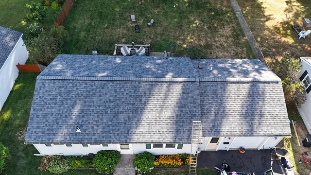 Residential roof replacement North End Burlington Vermont — completed Owens Corning shingles aerial view