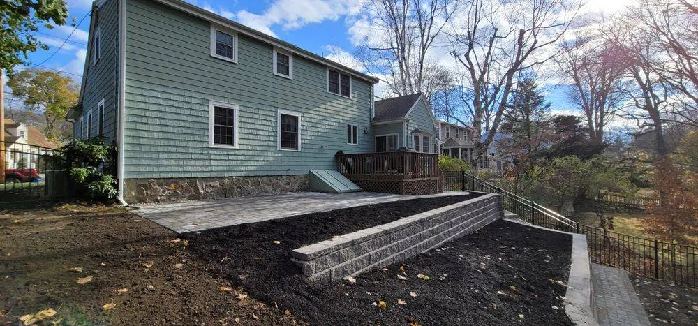 New block retaining wall and regraded yard