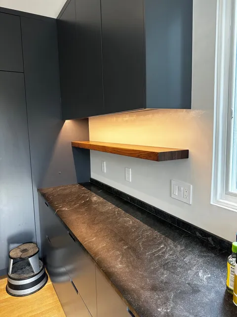 Custom walnut shelf and cabinet detail