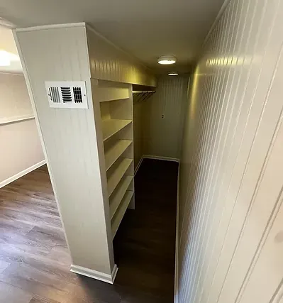 Renovated bedroom with walk-in closet addition.