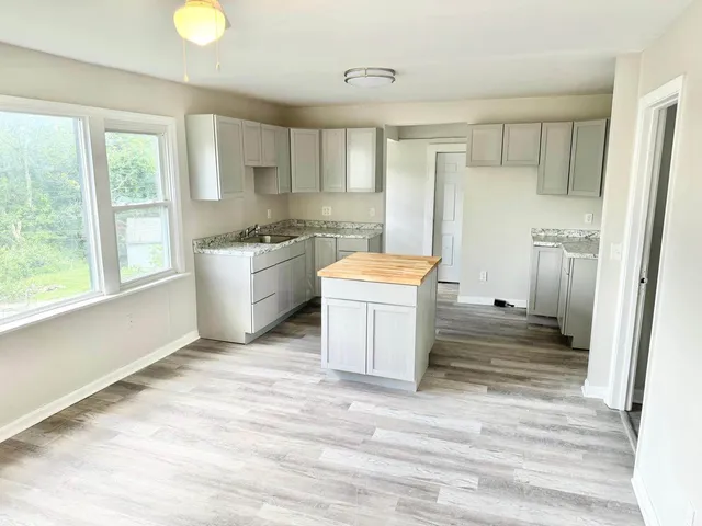 Completed kitchen remodel with updated cabinets, counters, and interior finishes