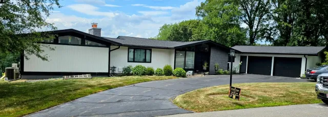 Sleek Black Seamless Gutter Installation in Leominster, MA