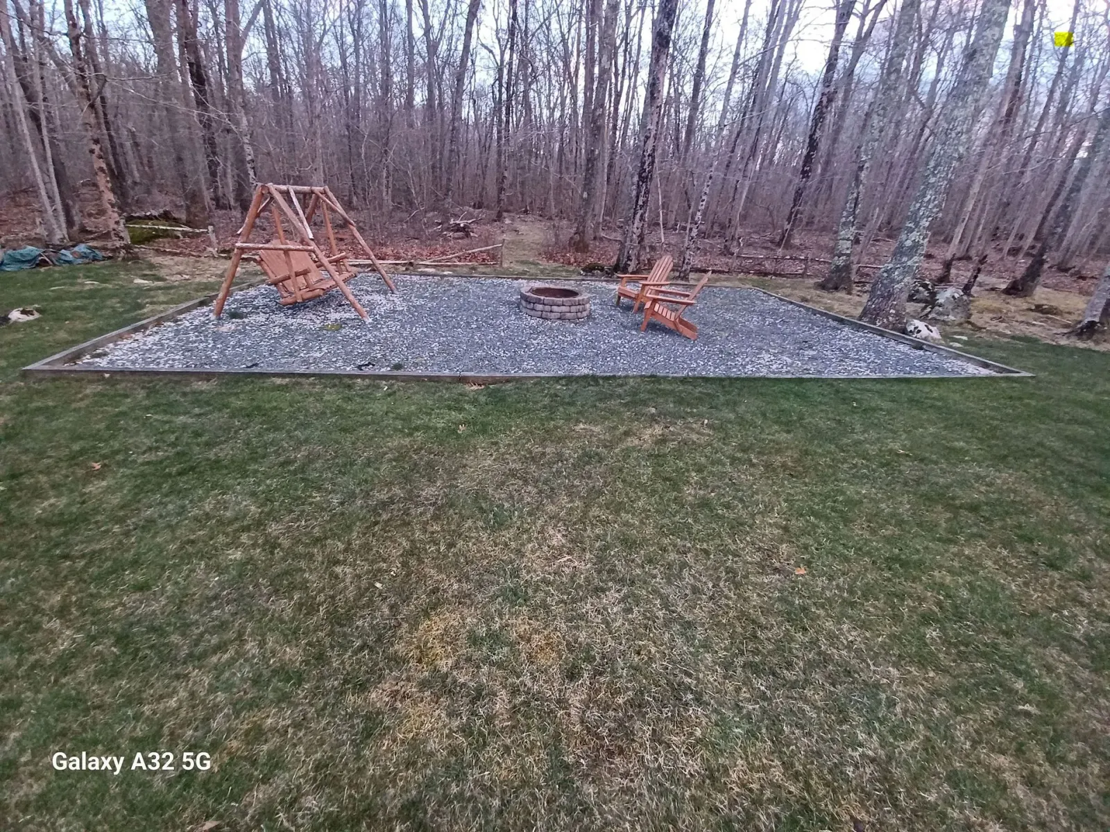 Before: Gravel patio with swing set