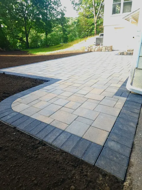 Paver patio with dark border. JR's Landscaping Hardscaping Lexington