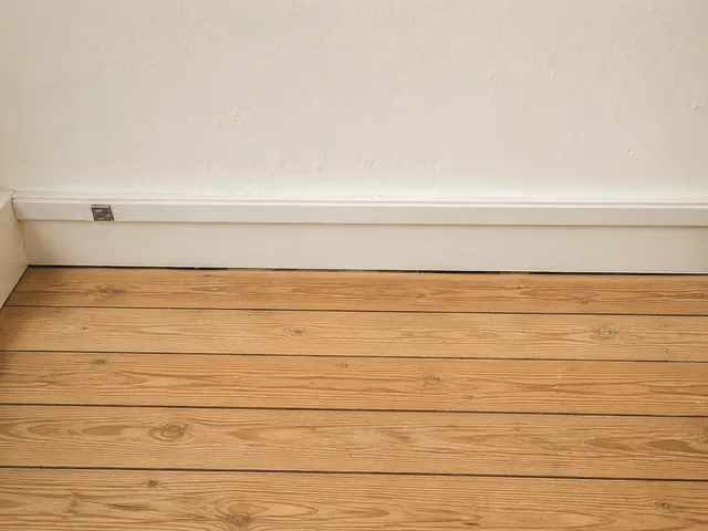 Finished basement with new flooring and lighting
