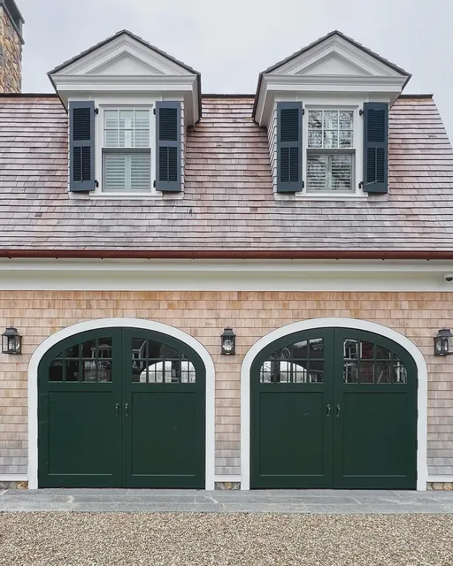 Swing out carriage doors evoke a timeless elegance with their graceful movement and classic design. Their charm lies in their traditional aesthetic, which adds character and sophistication to any style.⁣
⁣
⁣
#designergaragedoors #designerdoor #custom