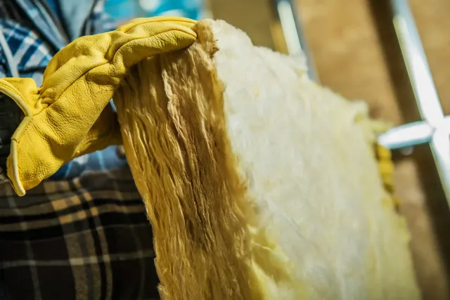 Blown-in cellulose insulation filling an attic floor in Connecticut
