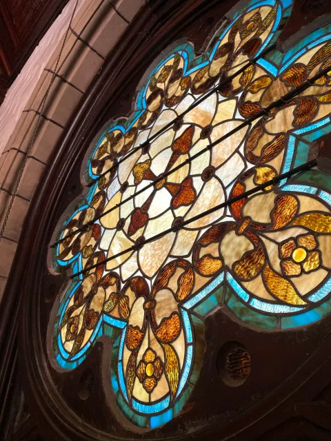 Multifoil stained glass window in Dickson Memorial Chapel at Greenlawn Cemetery in Salem, MA
