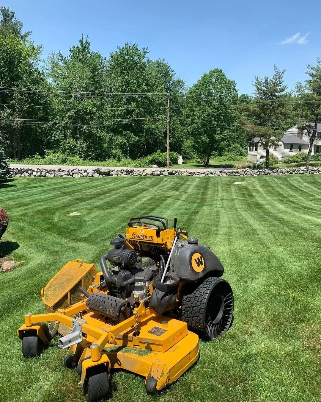 Freshly cut lawn in Groton, MA by Gardner's Landscaping, LLC