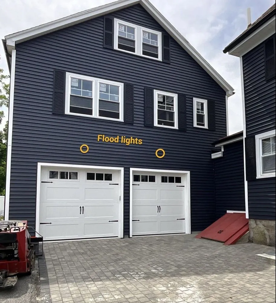 Annotated garage elevation showing flood light placement