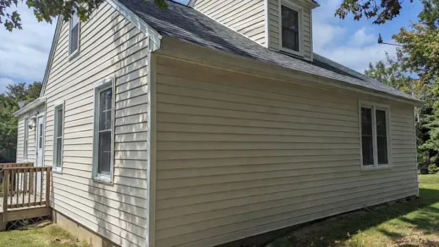 Vinyl siding installation on a residential home in Lynn, MA, showcasing durability and aesthetic appeal.