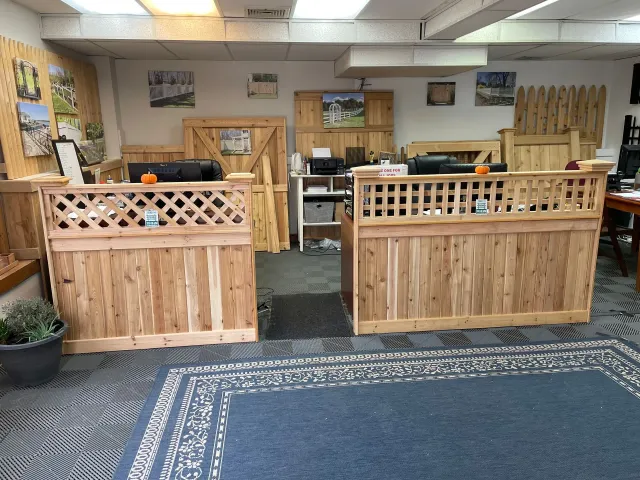 There are two wooden desks in the middle of the room.