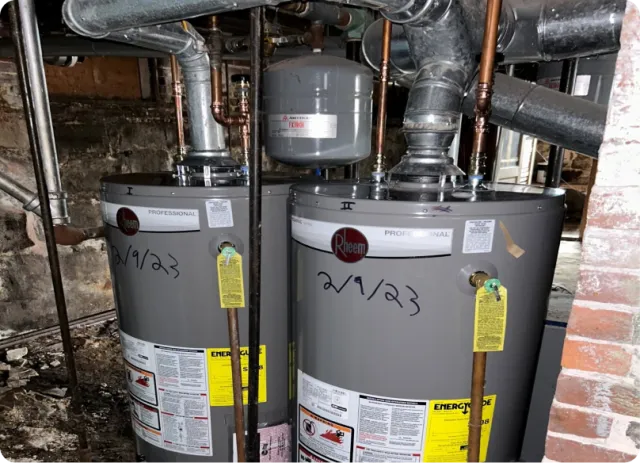 Pair of storage water heaters with venting with a clear equipment view