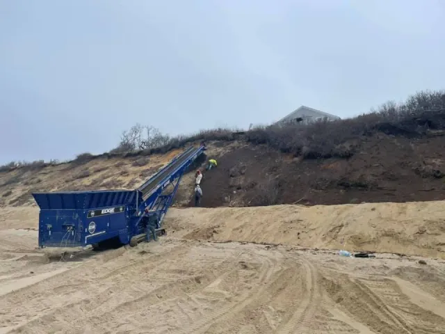 Forestry mulching machine clearing hillside vegetation