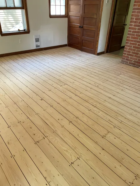 Freshly sanded hardwood floor, prepped for finishing