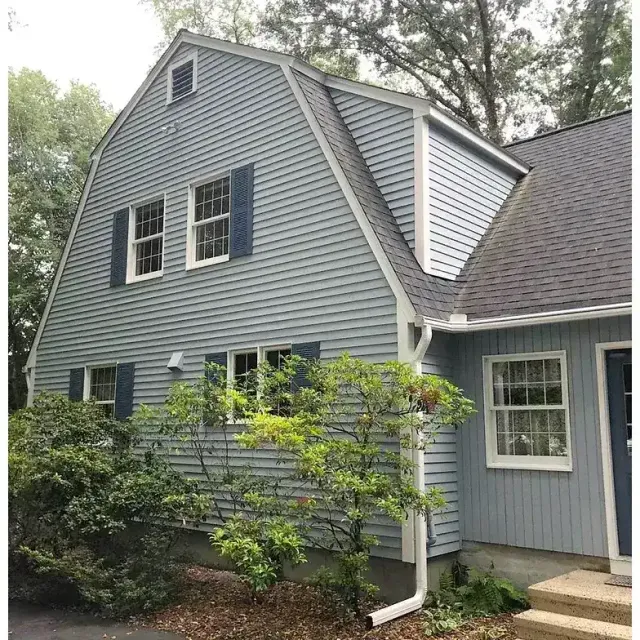 Gray gambrel home exterior, finished