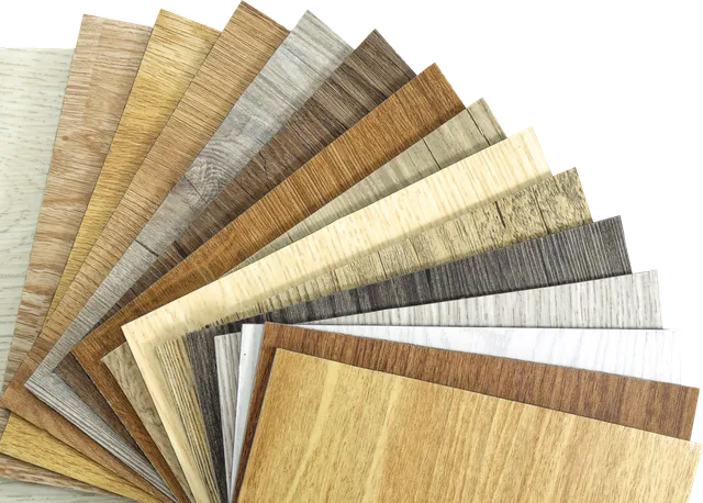 Swatches of various wooden textures and colors arranged in a fan shape, showcasing options for flooring or decor materials.