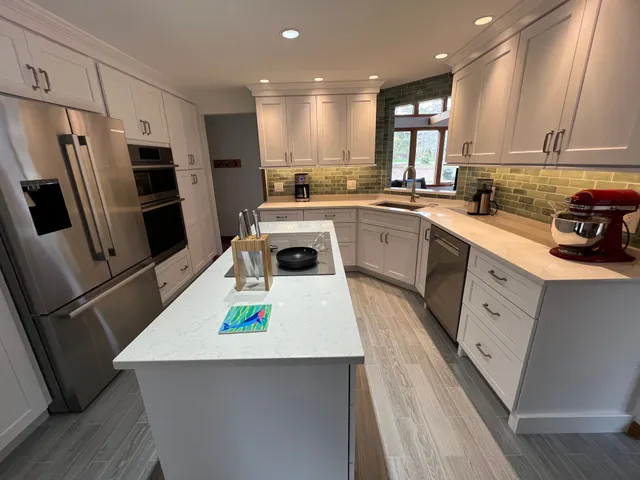 Bright custom kitchen with island and premium appliances