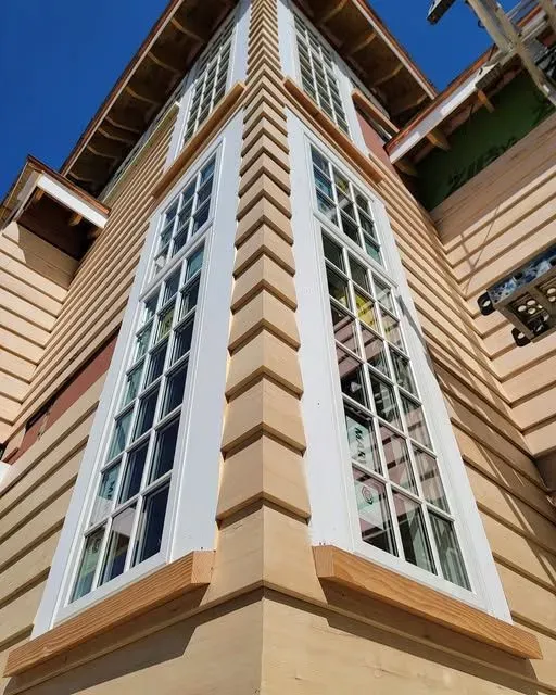 the corner of a building with many windows