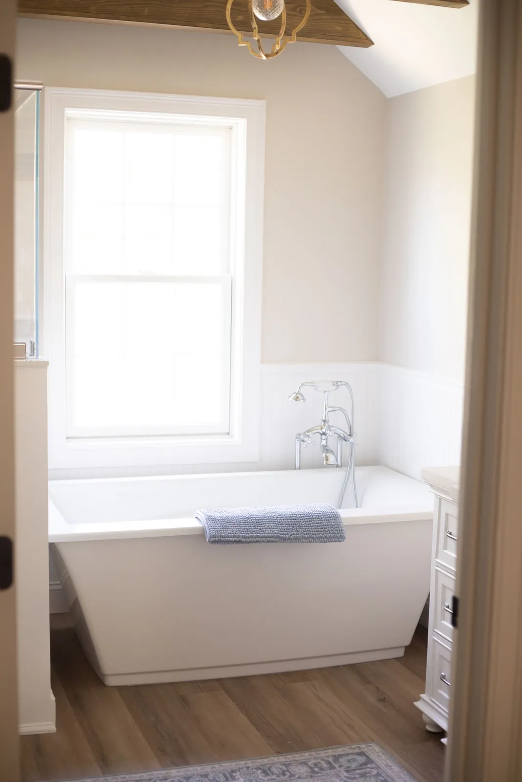 Freestanding tub in finished bath remodel