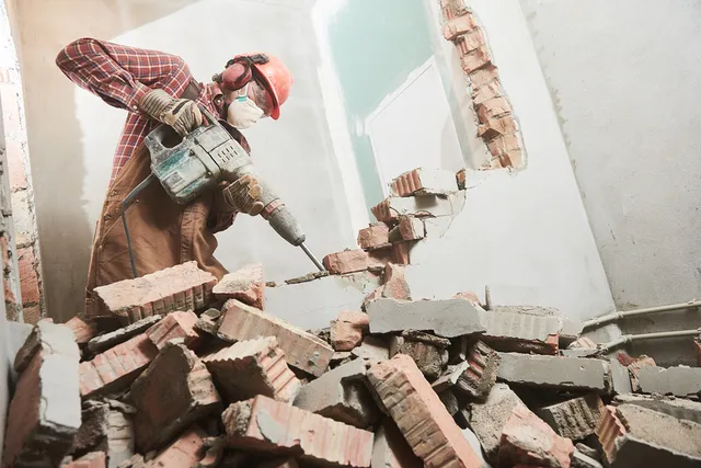 asbestos specialist working on removal process