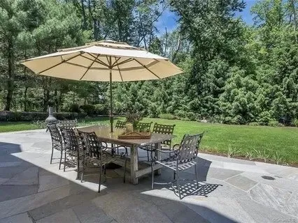 Bluestone patio with an outdoor dining set