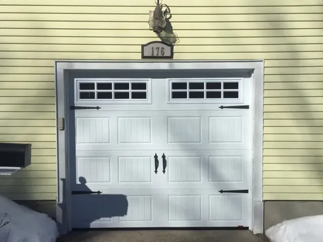 A white garage door with the number 175 on it