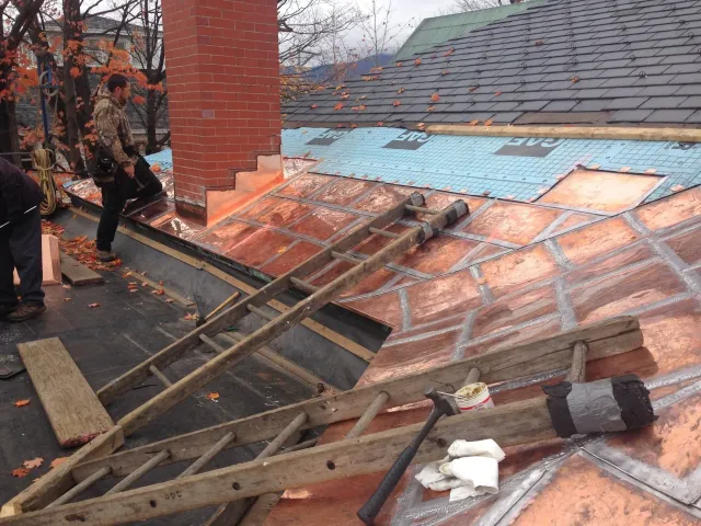 Rodd Roofing crew adding new copper roofing