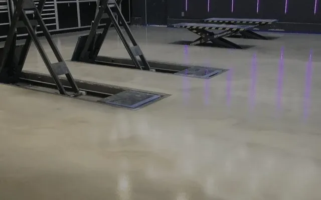 Vehicle lifts on polished garage floor