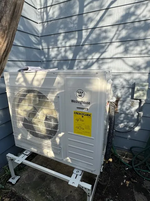 Clean outdoor AC unit installation with protective line set cover