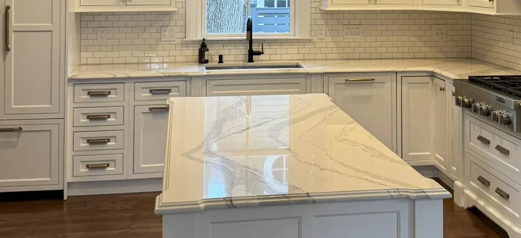 Marble island top and the cabinetry running behind it
