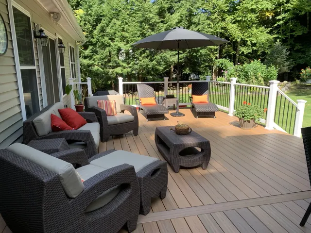 Exterior shot of new custom deck and patio furniture