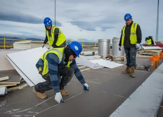 three gentlemen repairing roof
