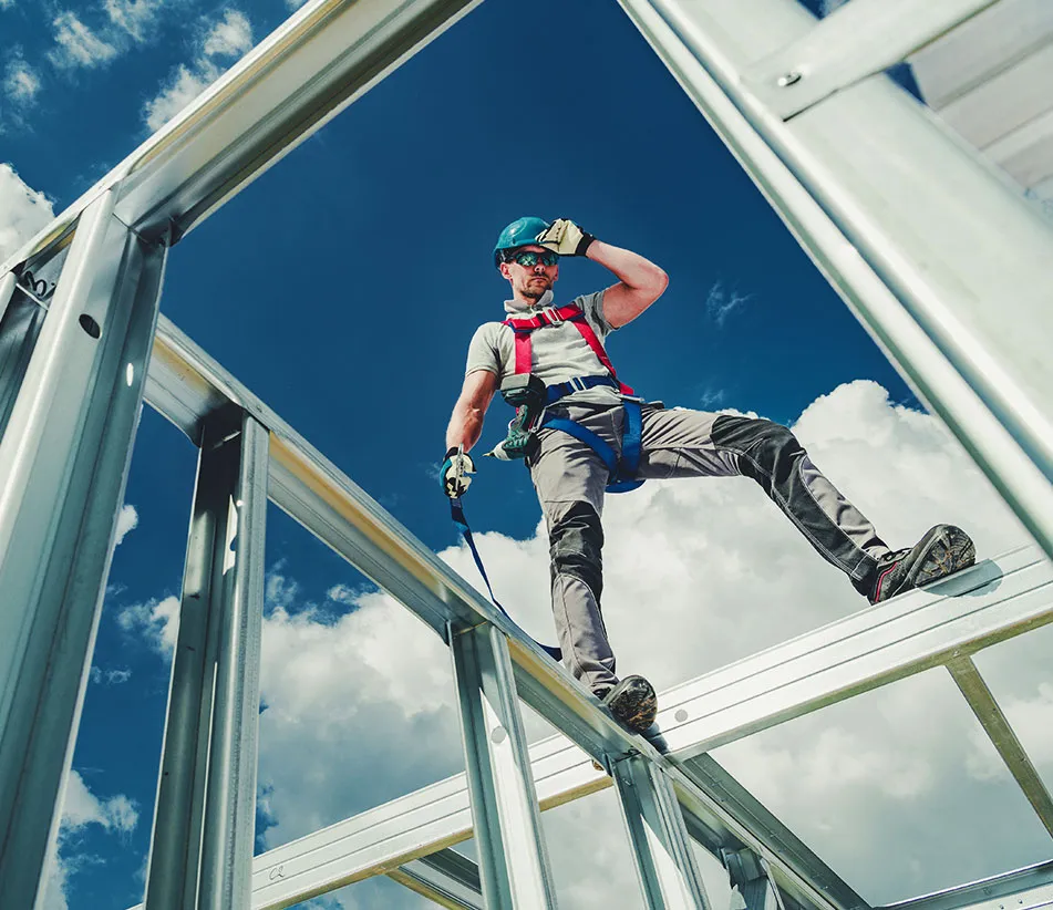 A Man working on a construction site. sky-shot.