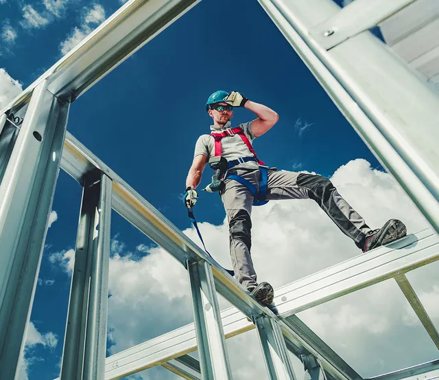 A Man working on a construction site. sky-shot.