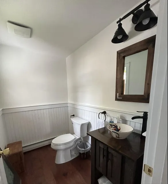 Powder room with new vanity light bar and exhaust fan