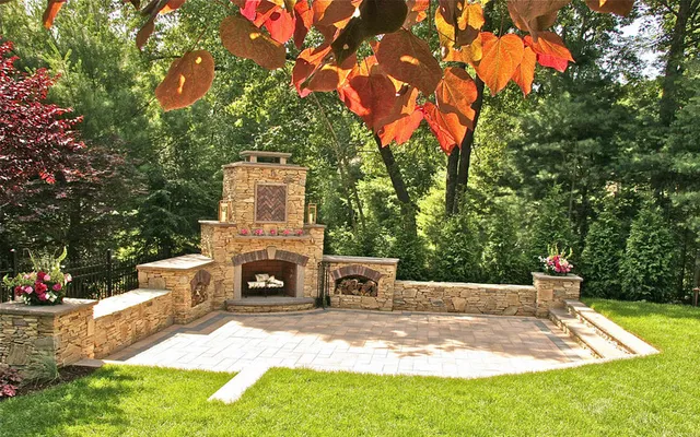 Stone fireplace with autumn plantings