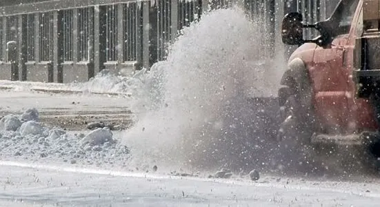 Snowplow on public road removing snow