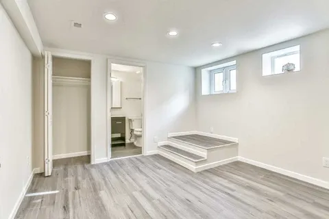 Finished basement with beige walls