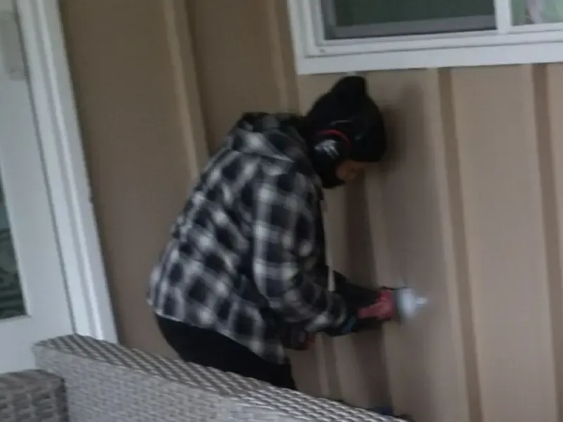 Professional electrician installing an exterior outlet in Somerville