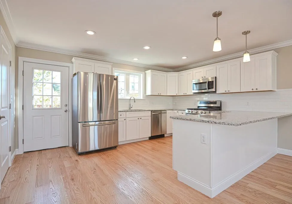 Kitchen peninsula subway tile backsplash stainless appliances new custom builder