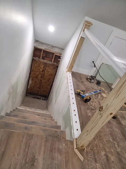 Basement stairwell, framing and board