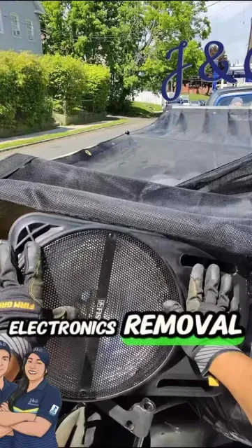 Close-up of a car interior being cleaned, with bold “ELECTRONICS REMOVAL” text overlaid.