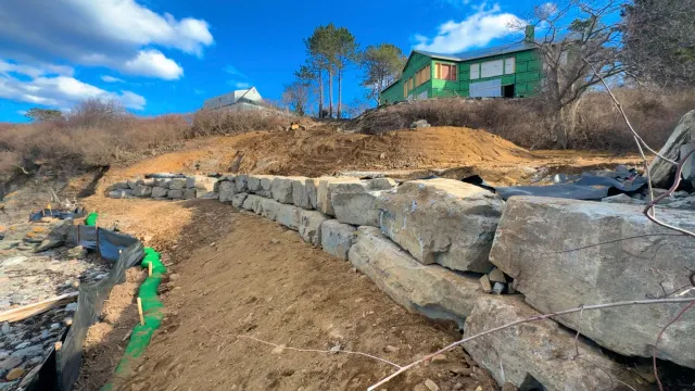 Granite retaining wall by Envy Excavation