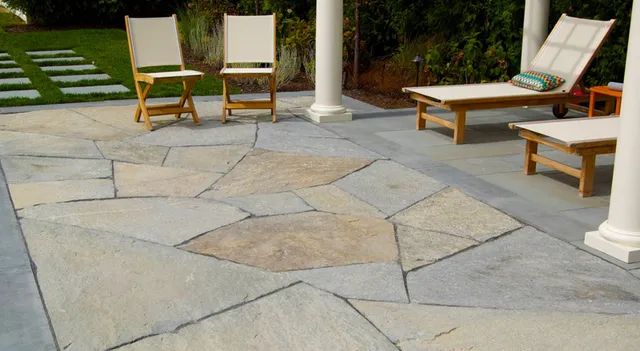 Natural stone patio with outdoor lounge furniture