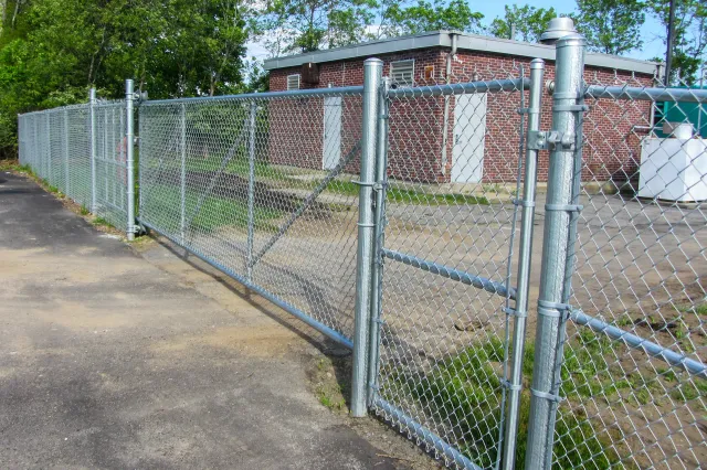 Chain link fencing installation by Olympic Fence Company for commercial sites and pet areas in the North Shore.