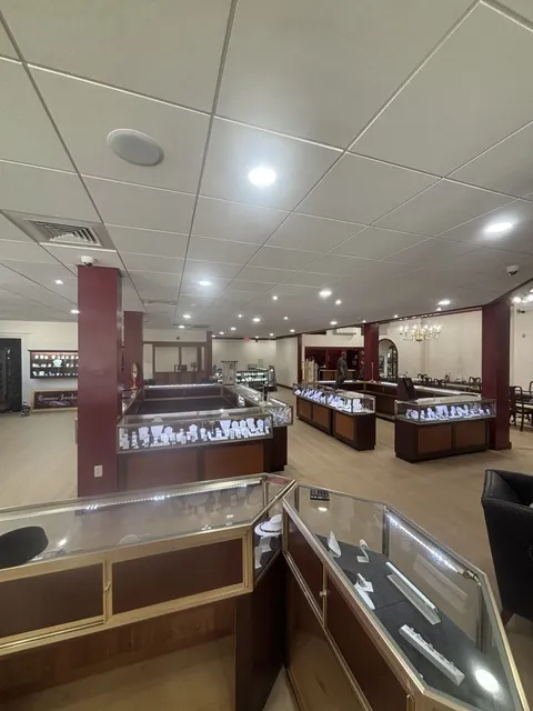 Jewelry showroom floor with display cases under rows of new recessed ceiling lights
