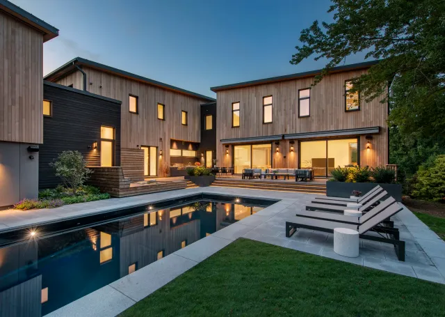 Twilight View of Pool Area at IDDLA's Modern Habitat Landscape