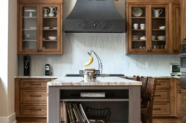 Wood cabinets in a historic home with modern appliances.