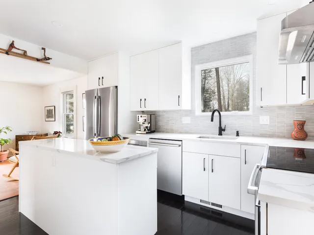 white kitchen cabinets dark wood floor